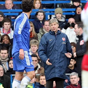 Arsene Wenger the Arsenal Manager talks to Michael Ballack (Chelsea)