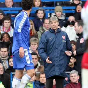 Arsene Wenger the Arsenal Manager talks to Michael Ballack (Chelsea)