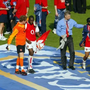 Arsene Wenger the Arsenal Managertalks to Ashley Cole at the end of the match Arsene Wenger the Arsenal Managertalks to Ashley Cole at the end of the match