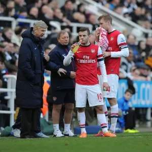 Arsene Wenger Conferring with Jack Wilshere and Per Mertesacker during Newcastle United vs Arsenal, Premier League 2013-14 Arsene Wenger Conferring with Jack Wilshere and Per Mertesacker during Newcastle United vs Arsenal, Premier League 2013-14