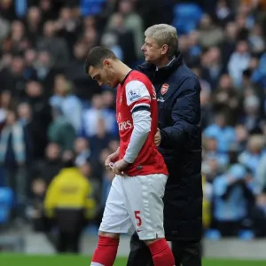 Arsene Wenger Consoles Sub Thomas Vermaelen during Manchester City vs. Arsenal (2013-14) Arsene Wenger Consoles Sub Thomas Vermaelen during Manchester City vs. Arsenal (2013-14)