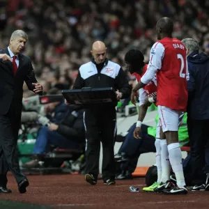 Arsene Wenger Consulting with Abou Diaby during Arsenal vs Fulham (2011-12) Arsene Wenger Consulting with Abou Diaby during Arsenal vs Fulham (2011-12)