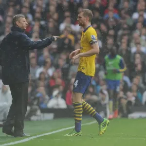 Arsene Wenger Consults Per Mertesacker During Fulham vs. Arsenal, 2013-14 Premier League Arsene Wenger Consults Per Mertesacker During Fulham vs. Arsenal, 2013-14 Premier League