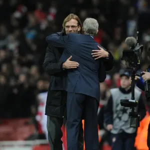 Arsene Wenger and Jurgen Klopp: A Heartfelt Embrace After Arsenal vs. Borussia Dortmund in the Champions League (2011)