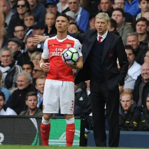 Arsene Wenger and Kieran Gibbs: A Behind-the-Scenes Moment at Tottenham Hotspur vs. Arsenal (2016-17) Arsene Wenger and Kieran Gibbs: A Behind-the-Scenes Moment at Tottenham Hotspur vs. Arsenal (2016-17)