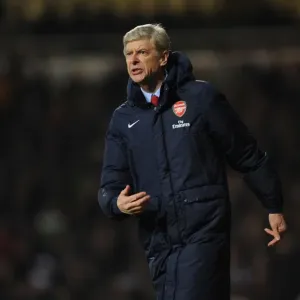 Arsene Wenger Leads Arsenal in Premier League Clash Against West Ham United (2013-14)