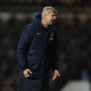 Arsene Wenger Leads Arsenal Against West Ham United in Premier League Clash (2013-14)