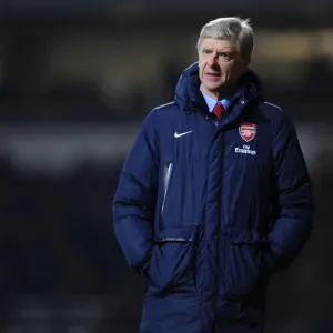 Arsene Wenger Leads Arsenal Against West Ham United in Premier League Clash (2013-14)