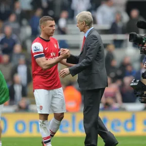 Arsene Wenger and Lukas Podolski Celebrate Arsenal's Win at Newcastle United (2012-13) Arsene Wenger and Lukas Podolski Celebrate Arsenal's Win at Newcastle United (2012-13)