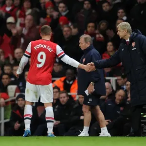 Arsene Wenger and Lukas Podolski: A Handshake at Emirates Stadium (Arsenal vs Crystal Palace, 2013-14)