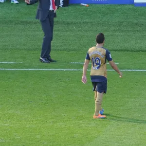 Arsene Wenger and Santi Cazorla: A Moment of Connection during the Leicester City vs. Arsenal Match, 2015 Arsene Wenger and Santi Cazorla: A Moment of Connection during the Leicester City vs. Arsenal Match, 2015
