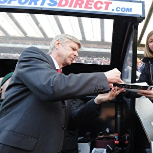 Arsene Wenger Signs Programme at Newcastle United vs Arsenal (2013-14)