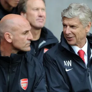 Arsene Wenger and Steve Bould: Arsenal's Coaching Duo at 2012 Pre-Season Match vs. Southampton Arsene Wenger and Steve Bould: Arsenal's Coaching Duo at 2012 Pre-Season Match vs. Southampton