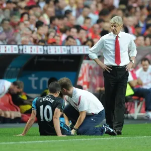 Arsene Wenger Tends to Injured Robin van Persie Print Arsene Wenger Tends to Injured Robin van Persie Print