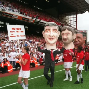 The Arsene Wenger and Tony Adams giant heads on the pitch during the final salute parade The Arsene Wenger and Tony Adams giant heads on the pitch during the final salute parade