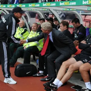 Arsene Wenger and Tony Pulis: Pre-Match Handshake at Stoke City vs Arsenal (2012-13) Arsene Wenger and Tony Pulis: Pre-Match Handshake at Stoke City vs Arsenal (2012-13)