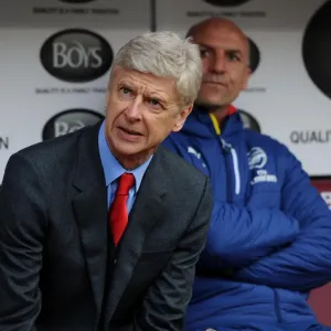Arsene Wenger: Unwavering Focus at the Turf Moor Sidelines (Burnley vs Arsenal, Premier League 2014/15) Arsene Wenger: Unwavering Focus at the Turf Moor Sidelines (Burnley vs Arsenal, Premier League 2014/15)