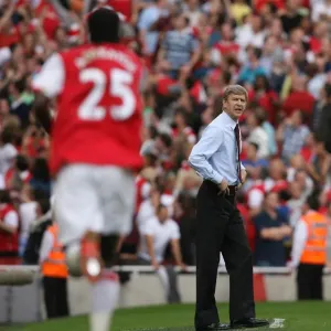 Arsene Wenger watches Emmanuel Adebayor celebrate scoring Arsenals 2nd goal his 1st Arsene Wenger watches Emmanuel Adebayor celebrate scoring Arsenals 2nd goal his 1st