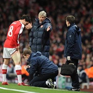 Arsene Wenger Watching Over Injured Samir Nasri during Arsenal's 5-0 Victory over FC Porto