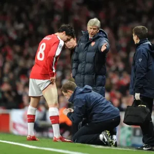 Arsene Wenger Watching Over Injured Samir Nasri during Arsenal's 5-0 Victory over FC Porto Arsene Wenger Watching Over Injured Samir Nasri during Arsenal's 5-0 Victory over FC Porto