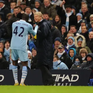Arsene Wenger and Yaya Toure: A Moment of Camaraderie Amidst Rivalry (Manchester City vs Arsenal, 2011-12)