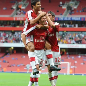Arsene Wenger's Men: Arshavin, Eduardo, and Merida Celebrate Arsenal's First Goal Against Athletico Madrid, Emirates Cup 2009