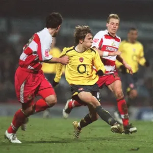 Arturo Lupoli (Arsenal) Ricky Ravenhill (Doncaster)