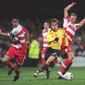 Arturo Lupoli (Arsenal) Steve Forster and Ricky Ravenhill (Doncaster)