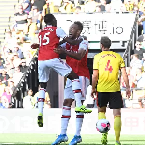 Aubameyang and Maitland-Niles Celebrate Arsenal's Win Against Watford (2019-20)