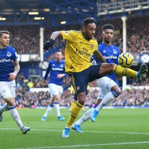 Aubameyang Under Pressure: Everton's Holgate and Digne Harass Arsenal Star