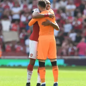 Aubameyang's Embrace: Arsenal's Victory Moment vs. West Ham United (2017-18) Aubameyang's Embrace: Arsenal's Victory Moment vs. West Ham United (2017-18)