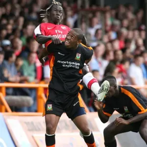 Bacary Sagna (Arsenal) Kieron St Aimie (Barnet) Bacary Sagna (Arsenal) Kieron St Aimie (Barnet)