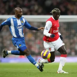 Bacary Sagna (Arsenal) Salomon Olembe (Wigan) Bacary Sagna (Arsenal) Salomon Olembe (Wigan)