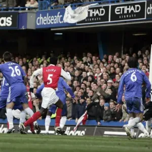 Bacary Sagna (far left) scores Arsenals goal with a header from a corner