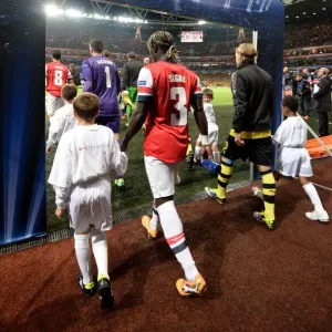 Bacary Sagna Leads Arsenal onto Emirates Stadium Field vs Borussia Dortmund, UEFA Champions League (2013)