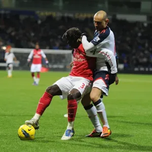 Bacary Sagna vs. Martin Petrov: Shielding the Ball in the Premier League Clash between Bolton Wanderers and Arsenal Bacary Sagna vs. Martin Petrov: Shielding the Ball in the Premier League Clash between Bolton Wanderers and Arsenal
