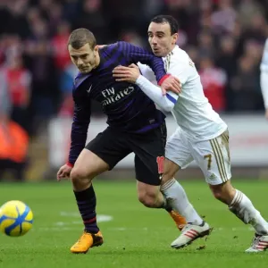 Battle of Midfield: Jack Wilshere vs. Leon Britton - Swansea vs. Arsenal FA Cup Clash Battle of Midfield: Jack Wilshere vs. Leon Britton - Swansea vs. Arsenal FA Cup Clash