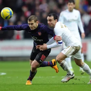 Battle of Midfield: Jack Wilshere vs. Leon Britton - FA Cup Showdown, 2013: Arsenal's Wilshere Outmaneuvers Swansea's Britton Battle of Midfield: Jack Wilshere vs. Leon Britton - FA Cup Showdown, 2013: Arsenal's Wilshere Outmaneuvers Swansea's Britton