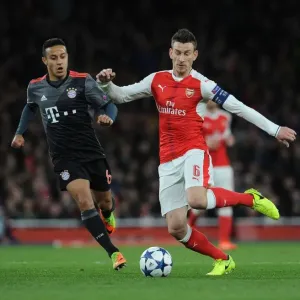 Battle of Midfield Titans: Koscielny vs Thiago in Arsenal vs Bayern Munich Champions League Showdown Battle of Midfield Titans: Koscielny vs Thiago in Arsenal vs Bayern Munich Champions League Showdown