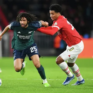 Battle for Possession: Mohamed Elneny vs. Malik Tillman - PSV Eindhoven vs. Arsenal FC, UEFA Champions League 2023/24 Battle for Possession: Mohamed Elneny vs. Malik Tillman - PSV Eindhoven vs. Arsenal FC, UEFA Champions League 2023/24
