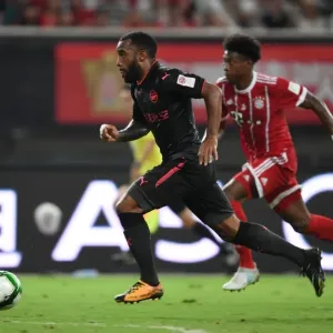 Battle in Shanghai: Lacazette vs. Alaba - Arsenal Forward's Duel with Bayern Munich Defender