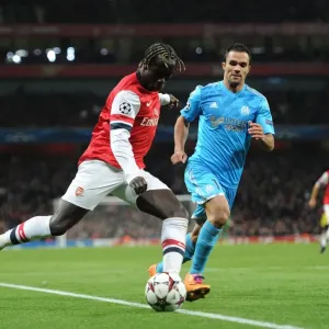 Battling Cross: Sagna vs. Morel in Arsenal's UEFA Champions League Clash (2013) Battling Cross: Sagna vs. Morel in Arsenal's UEFA Champions League Clash (2013)