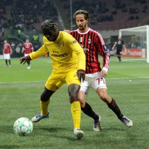 Battling for Possession: Bacary Sagna vs. Luca Antonini - AC Milan vs. Arsenal, UEFA Champions League 2012 Battling for Possession: Bacary Sagna vs. Luca Antonini - AC Milan vs. Arsenal, UEFA Champions League 2012