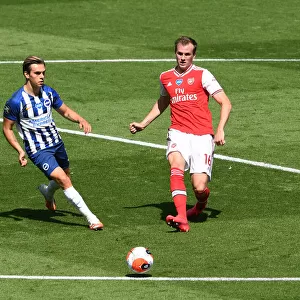 Brighton vs. Arsenal: Holding Defends Amidst Trossard Pressure (Premier League 2019-20)