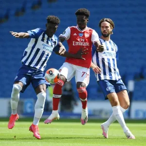 Brighton vs. Arsenal: Empty Stadium Showdown - Bukayo Saka vs. Yves Bissouma