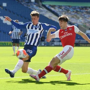 Brighton vs Arsenal: Empty Stadium Showdown - Kieran Tierney Clashes with Solly March (Premier League, 2020)