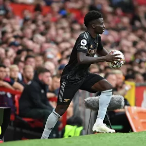 Bukayo Saka in Action: A Football Battle at Old Trafford - Manchester United vs. Arsenal, Premier League 2022-23
