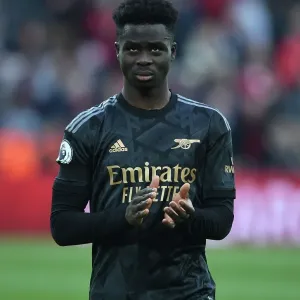 Bukayo Saka Salutes Arsenal Fans: Triumphant Moment at Anfield After Intense Liverpool Clash (Premier League 2022-23) Bukayo Saka Salutes Arsenal Fans: Triumphant Moment at Anfield After Intense Liverpool Clash (Premier League 2022-23)