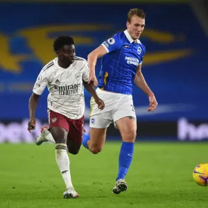 Bukayo Saka vs. Dan Burn: A Fierce Battle – Arsenal's Triumph over Brighton & Hove Albion, Premier League 2020-21
