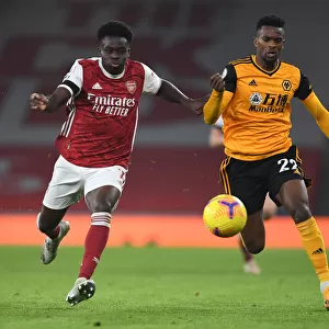 Bukayo Saka vs. Nelson Semedo: A Battle at Empty Emirates - Arsenal vs. Wolverhampton Wanderers (Premier League 2020-21)